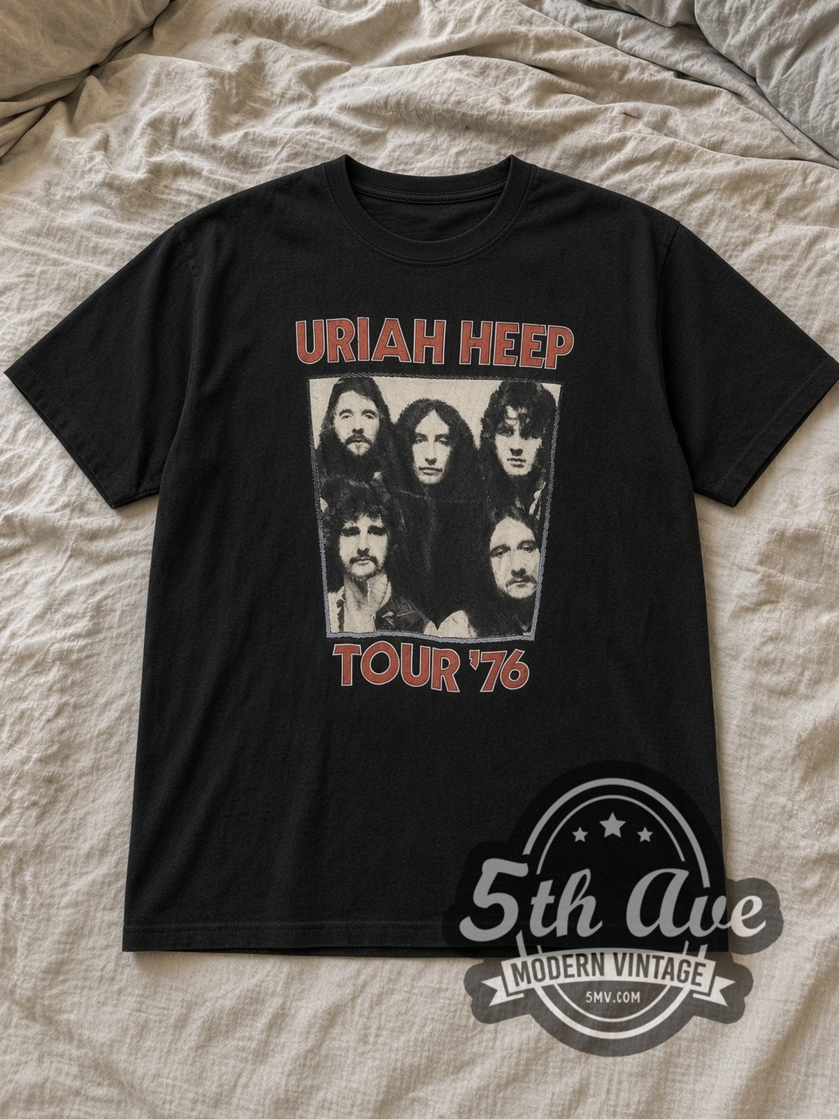 Black Uriah Heep Vintage Band T-Shirt laid flat on a linen bed
