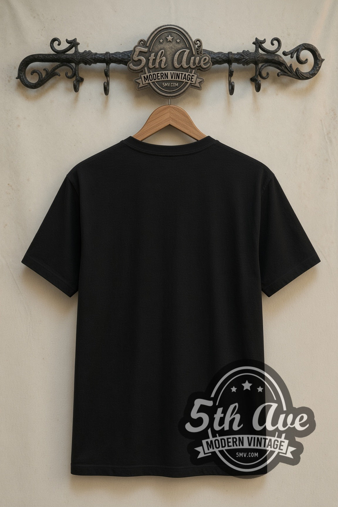 Plain black back of Wednesday Addams with Thing double stitched tee on rack