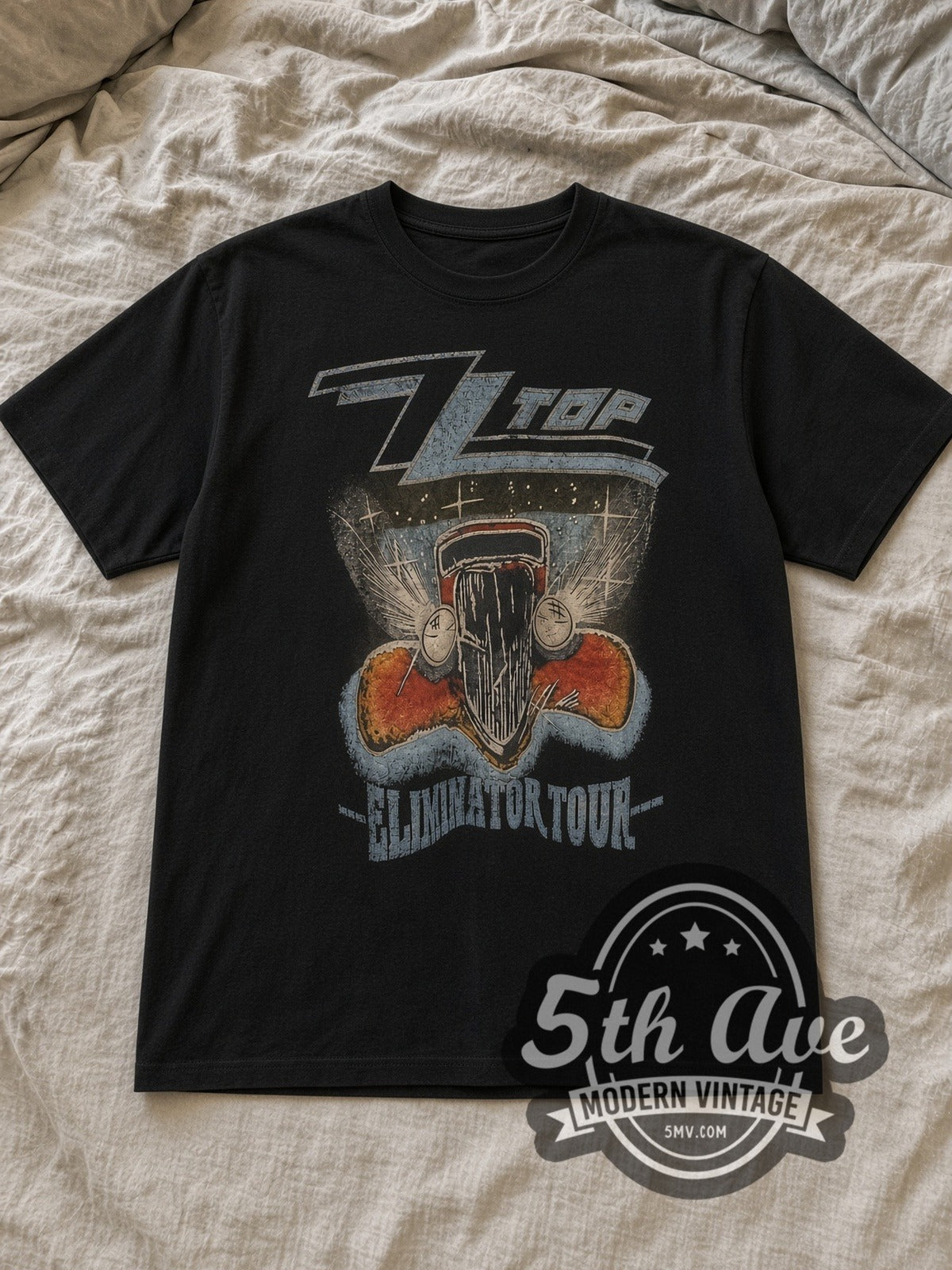 Black ZZ Top Vintage Band T-Shirt laid flat on a linen bed