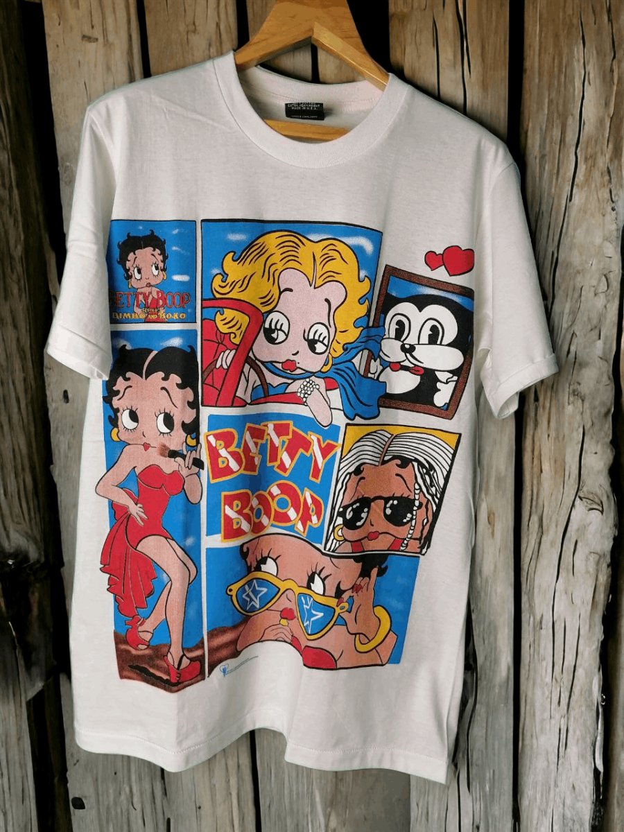 Betty Boop's Collage Couture: A t shirt Tale of Iconic Imagery and Whimsical Charm - Vintage Band Shirts
