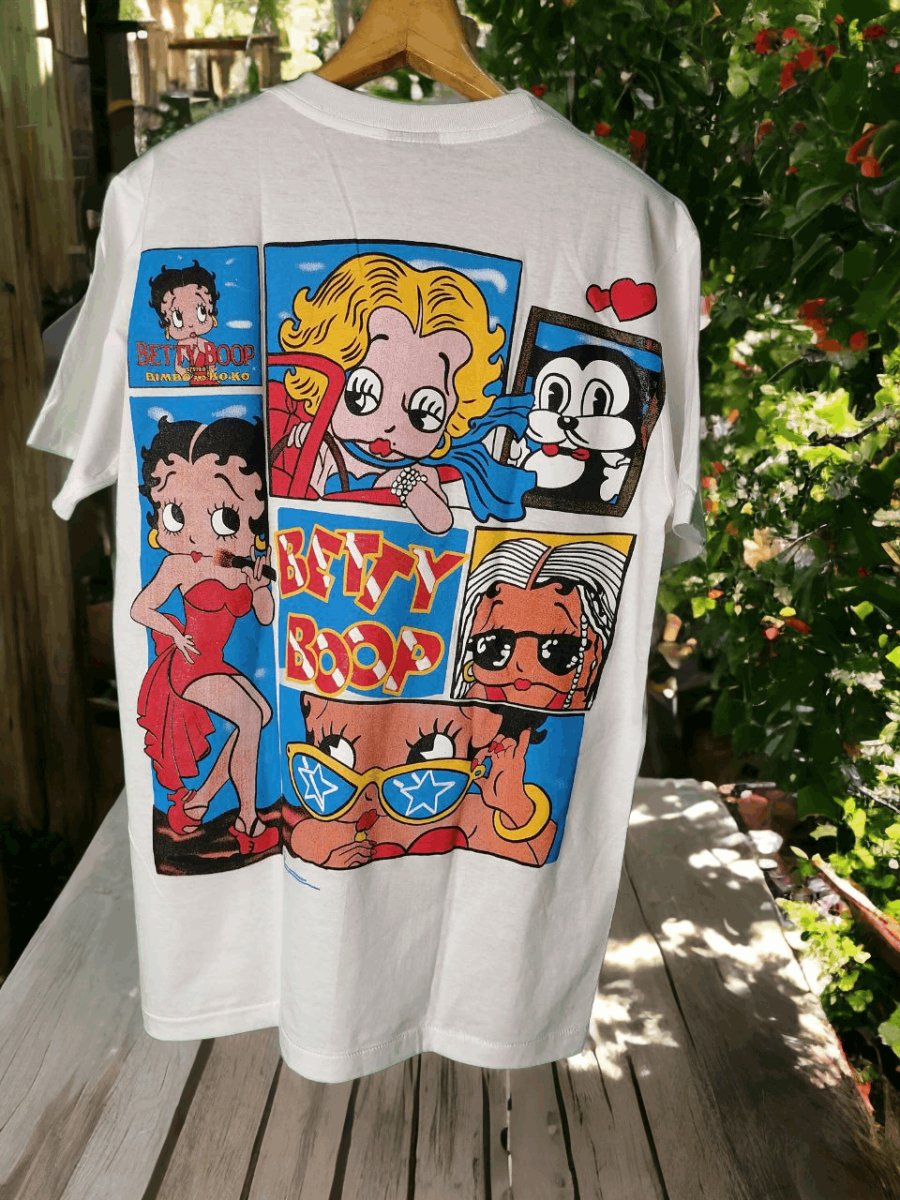Betty Boop's Collage Couture: A t shirt Tale of Iconic Imagery and Whimsical Charm - Vintage Band Shirts